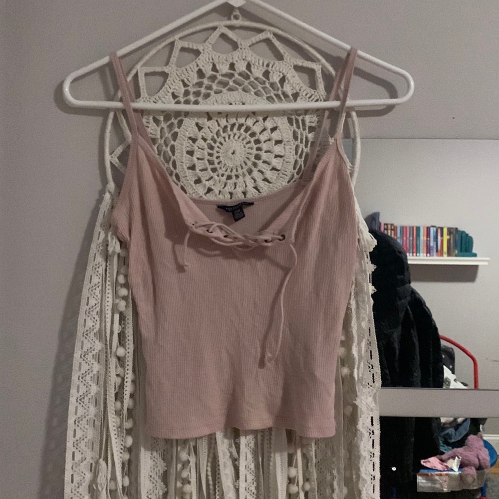 It’s a rose colored tank with a tie in the front